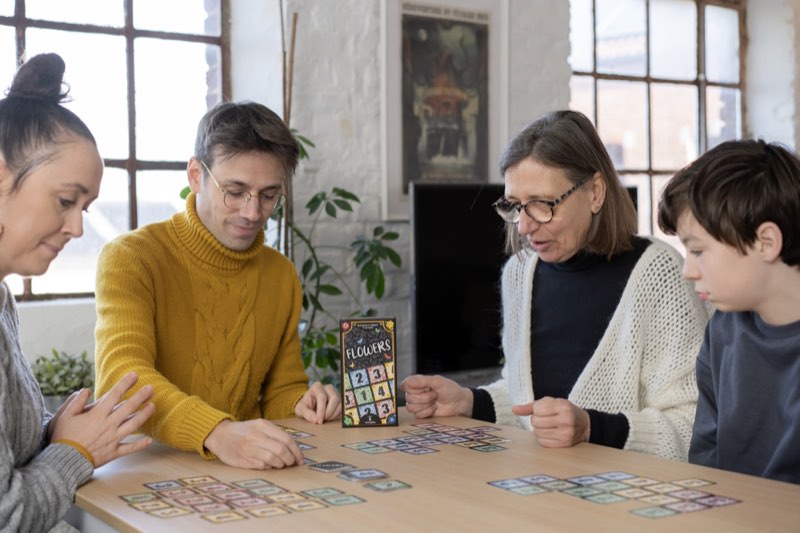 Family enjoying Flowers card game