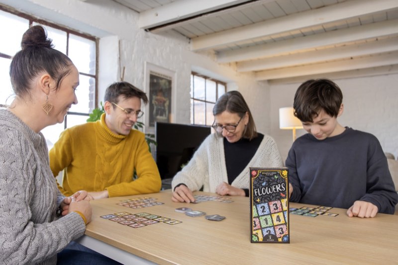 Family enjoying Flowers card game