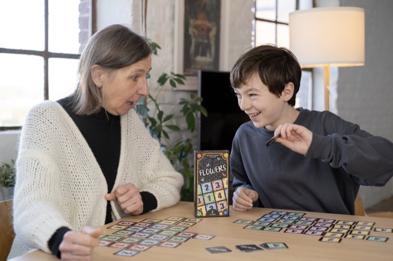Family enjoying Flowers card game