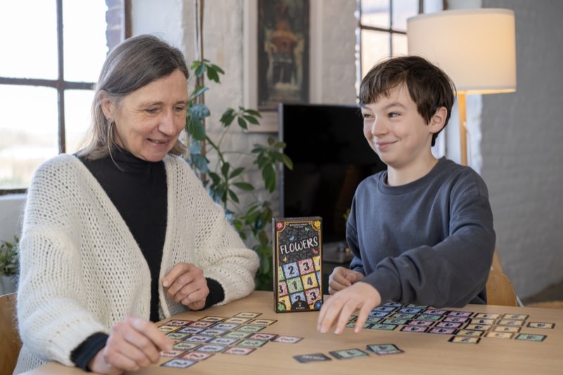 Family enjoying Flowers card game