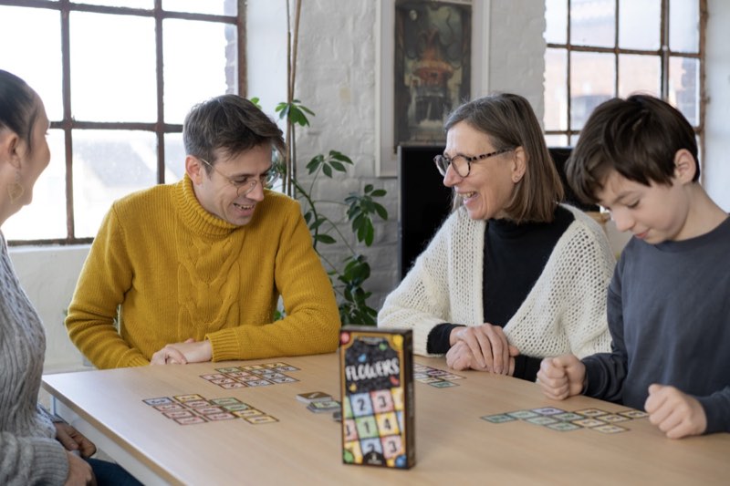 Family enjoying Flowers card game