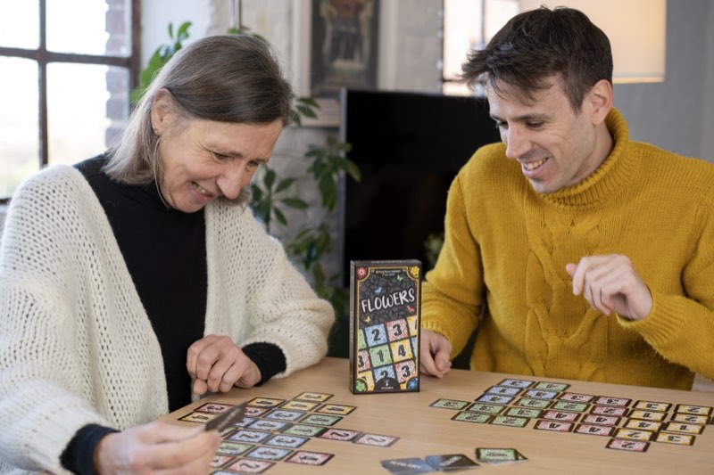 Family enjoying Flowers card game